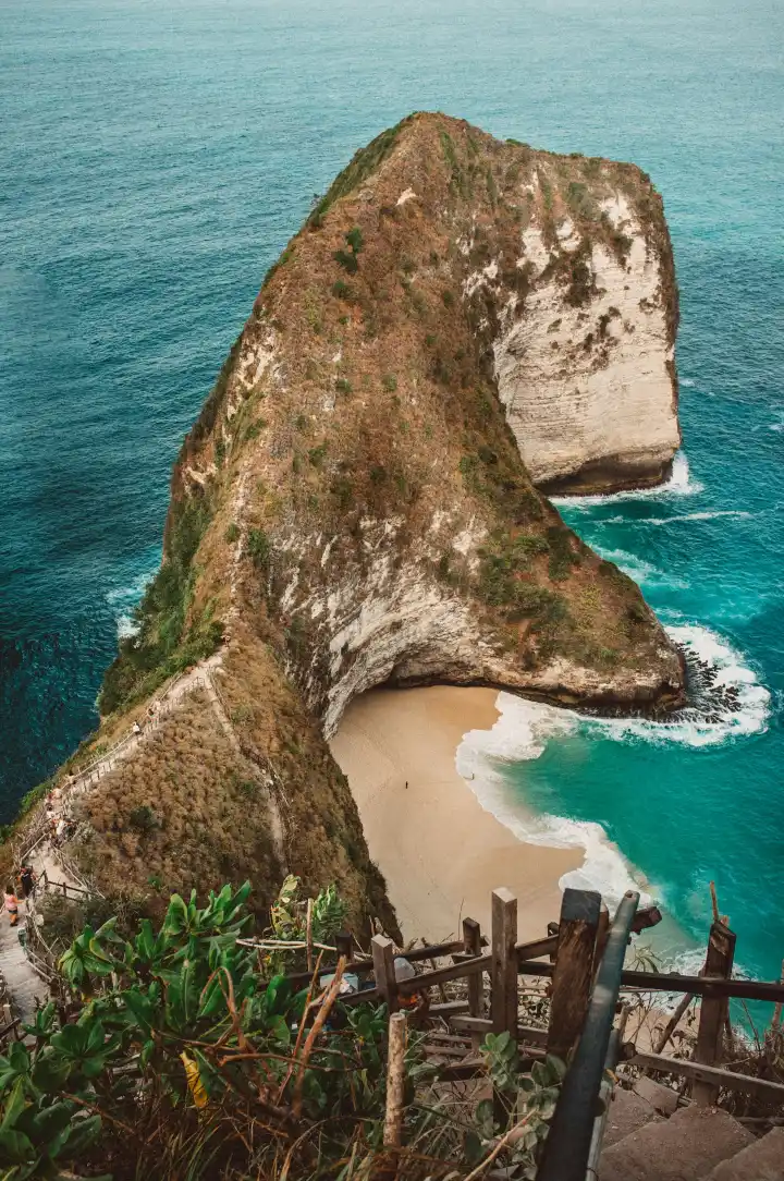 Dramatic green cliffs and blue ocean on the Bali coast