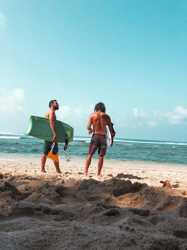 A group of friends moving together on a Bali beach